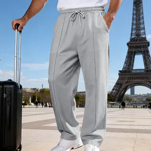 Comfortable loose fit grey knit joggers for men featuring drawstring waist in travel setting