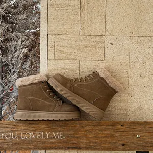 Stylish brown women's retro snow boots featuring thick soles and cozy plush lining for winter