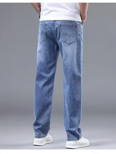 Back view of men's blue straight leg jeans with classic pocket embroidery detail