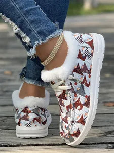 Close-up of cozy winter loafers with Christmas gnome pattern and white faux fur lining