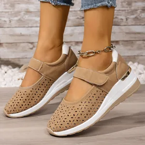 Close-up of women's khaki platform shoes featuring breathable hollow-out laser-cut patterns