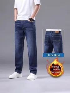 Casual men's winter fleece lined straight leg denim jeans in a classic deep blue wash