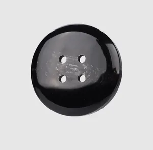 Close-up detail of a high-end glossy black resin button with a four-hole design