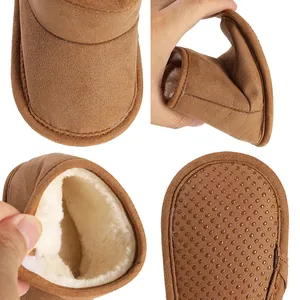 Close-up view of warm baby winter boots with plush lining and anti-slip rubber soles.