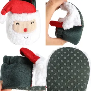 Detail view of soft Christmas baby shoes with anti-slip soles and Santa Claus design.