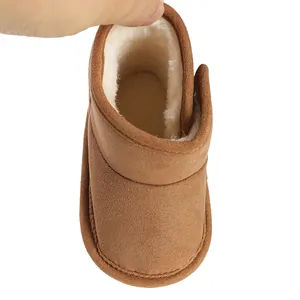 Close-up view of thick warm faux fur lining inside brown infant winter boots for newborns