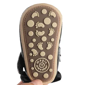 Close-up of non-slip rubber sole detail for infant baby girl pre-walker shoes in brown