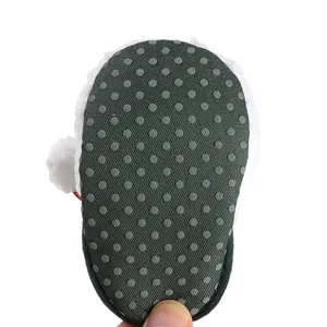 Close-up view showing the anti-slip dotted rubber sole of these infant winter cotton boots