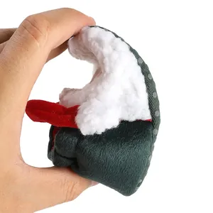 Flexible newborn Christmas baby shoe showing soft velvet and fleece texture