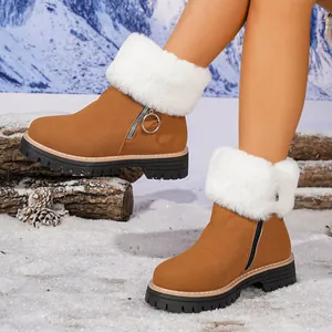Women's camel suede snow boots with white faux fur trim and thick soles for winter.