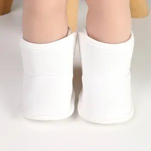 Close-up of white fleece-lined baby winter boots for newborn toddlers