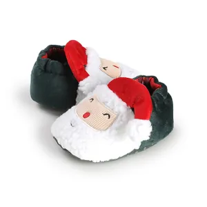 Close-up of cute Santa Claus plush baby slippers designed for newborn winter footwear