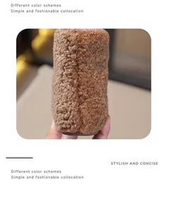 Detailed close-up view of the soft brown fuzzy texture on children's faux lamb wool snow boots