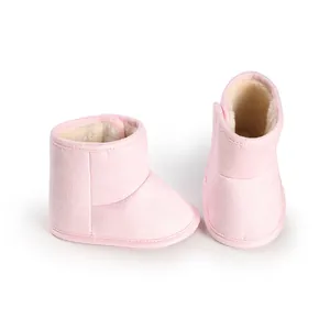 Detailed macro view of pink fleece-lined baby winter boots with soft non-slip sole