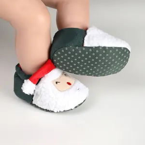 Close-up detail of plush Christmas Santa baby winter cotton shoes with anti-slip soles