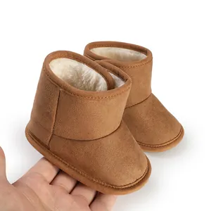 Detail of brown suede baby boots featuring warm faux fur lining and soft non-slip sole