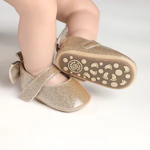 Detailed view of gold glitter baby Mary Jane shoes featuring a non-slip rubber sole