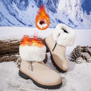Detail showing the thick warm faux fur lining in beige winter snow boots with side zipper