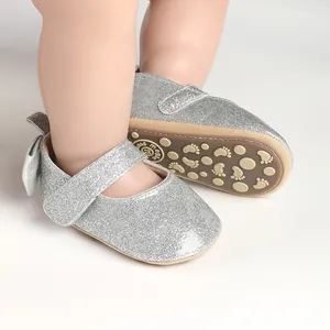 Detailed view of silver glitter baby girl pre-walker shoes with non-slip soft soles