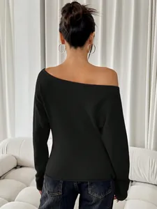 Back view of a black off-the-shoulder long sleeve ribbed top for casual daily wear.