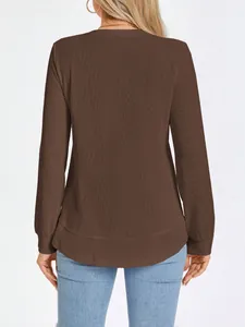 Back view of a brown waffle-knit crewneck long sleeve top for women in a casual style.