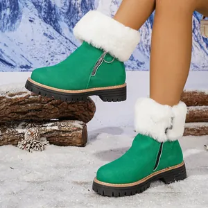 Detailed view of green suede winter boots featuring plush fur collar and side zipper