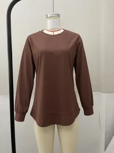 Detailed front view of a comfortable brown crew neck long-sleeved top for women.