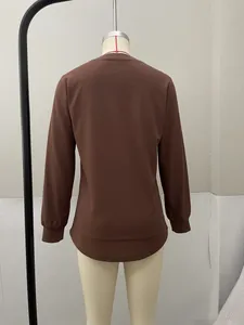 Detailed back view of a chocolate brown long-sleeved casual top for women on mannequin.