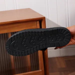 Detailed view of non-slip black textured rubber sole for women's winter warm shoes