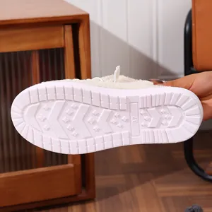 Detail view of white anti-slip sole for fuzzy fleece-lined winter loafers for women.