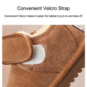Gros plan du scratch pratique sur les bottes de neige d'hiver épaisses pour enfants