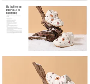 Close-up of cozy fleece-lined baby winter snow boots featuring cute bear patterns