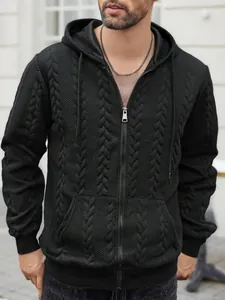 Close-up detail of men's black zip-up hoodie featuring a unique cable-knit texture pattern