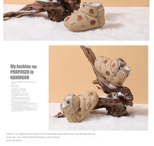 Detailed view of fleece-lined infant snow boots with bear pattern and warm lining
