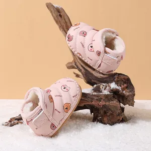 Warm pink baby winter snow boots featuring cute bear patterns and thick white fleece lining