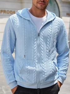 Detail of men's light blue zip-up hoodie featuring unique cable knit and diamond patterns