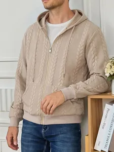 Close-up of men's beige cable-knit hooded zip-up sweatshirt with textured pattern