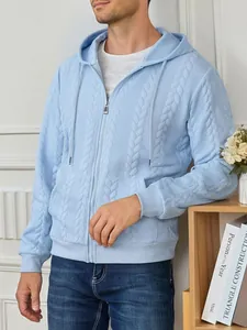 Detail view of men's light blue zip-up hoodie featuring a classic cable-knit pattern