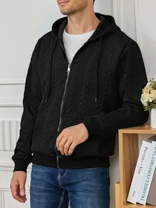 Detail view of men's black cable-knit zip-up hoodie with premium textured pattern