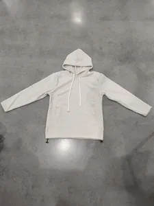 Overhead view of a cream-colored men's polar fleece hoodie with adjustable drawstring hem