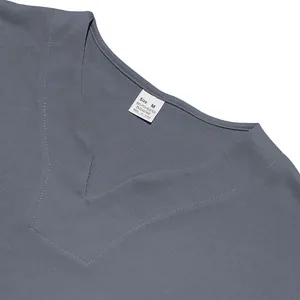 Close-up view of grey V-neck t-shirt neckline showing stitching and material tag info