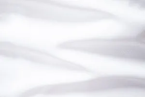 Detailed close-up showing the smooth white premium fabric texture for men's business suits