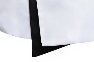 Macro detail of white slim fit suit jacket with elegant black contrast trim design