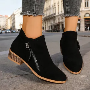 Chic women's black suede ankle boots featuring double side zippers and chunky heels