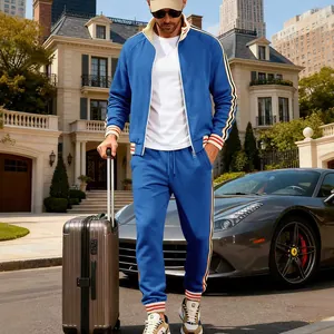 Heavyweight fleece men's tracksuit blue two-piece set worn outdoors with luggage