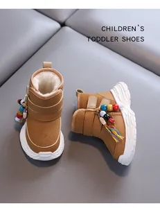 Cozy brown toddler snow boots with plush lining and colorful bead charms for winter