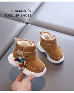 Detailed view of warm brown toddler snow boots with plush lining and colorful beads