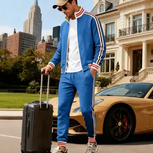 Blue heavy fleece men's tracksuit set with striped cuffs in luxury setting