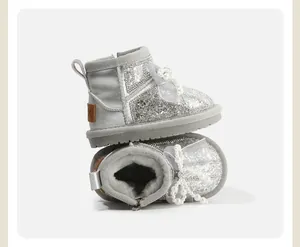 Sparkly silver glittery toddler snow boots with elegant pearl bow and warm fur lining
