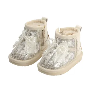 Girls' toddler snow boots with sparkling sequins, pearls, and elegant large bows.